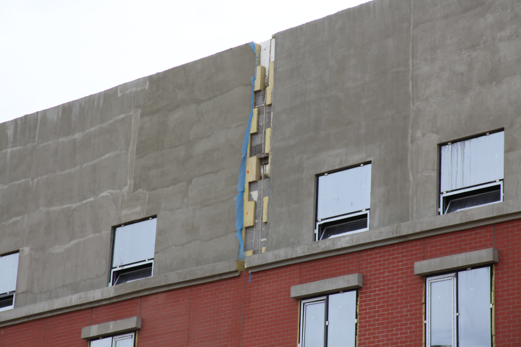 Надежный крепеж ЕКТ на фасаде ЖК "Гармония"